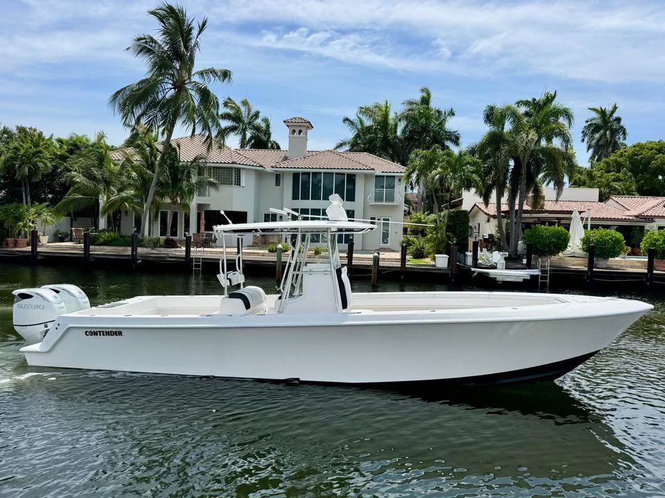 Center console boat moored at a private waterfront dock